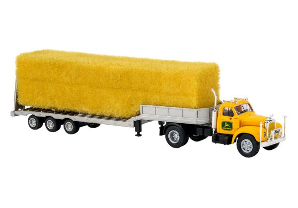Brekina 85984 - Spur HO Mack B61 mit beladenem Tieflader, gelb